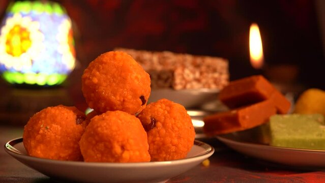 Peanut chikki candy gajak, Laddu, Indian sweet foods specially made for festivals of India like Diwali, Dussehra, Holi, ganesh chaturthi, Ram navami, Durga pooja, durga ashtami, Navratri.