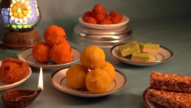 Peanut chikki candy gajak, Laddu, Indian sweet foods specially made for festivals of India like Diwali, Dussehra, Holi, ganesh chaturthi, Ram navami, Durga pooja, durga ashtami, Navratri.