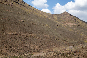 Sani mountain pass with sky and clouds out of focus with grain