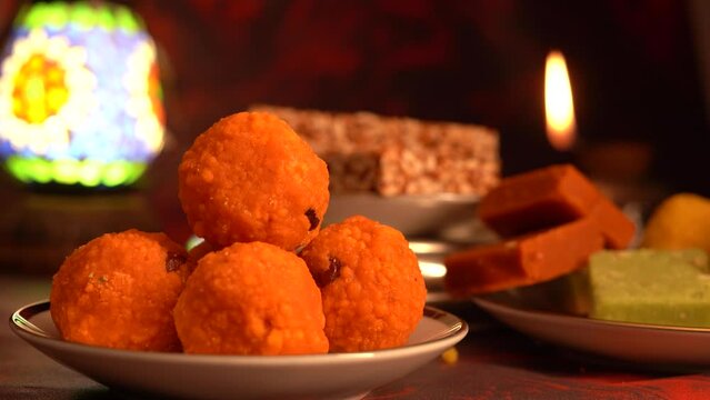 Peanut chikki candy gajak, Laddu, Indian sweet foods specially made for festivals of India like Diwali, Dussehra, Holi, ganesh chaturthi, Ram navami, Durga pooja, durga ashtami, Navratri.
