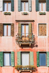 Fototapeta na wymiar Facade of old buildings in Venice, Italy, 2019