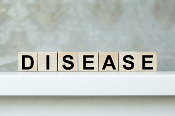 Disease word on wooden cubes isolated on the table
