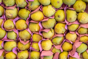 Figs on the market counter. Pile of ripe figs