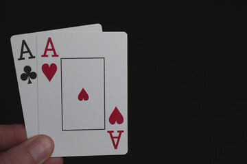 Playing cards two aces on a black