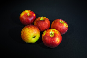 Fototapeta na wymiar red apples on a black background