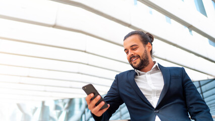 Businessman standing outdoor use smartphone