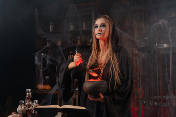 Halloween, witch use magic book and cauldron prepare poison or love potion