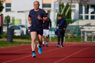 A man running on a running track
