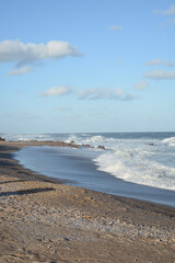 consists of the sea with stones and the water breaking