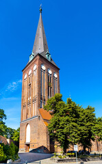 XV century St. John the Baptist gothic church in historic old town quarter of Stargard in Poland - obrazy, fototapety, plakaty