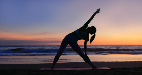 woman practice yoga on beach