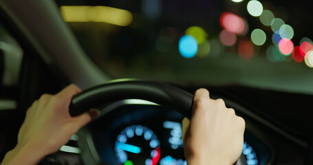 Obraz premium woman is driving at night