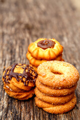 Fresh homemade biscuits in stock. Sweet cookies on a wooden table. Dessert sweet biscuits for tea and coffee. Concept of yummy, cookies, desserts.