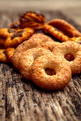 Fresh homemade biscuits in stock. Sweet cookies on a wooden table. Dessert sweet biscuits for tea and coffee. Concept of yummy, cookies, desserts.