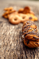 Fresh homemade biscuits in stock. Sweet cookies on a wooden table. Dessert sweet biscuits for tea and coffee. Concept of yummy, cookies, desserts.