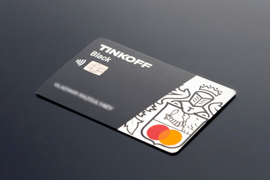Tinkoff Bank plastic credit debit card close-up on black background. krasnoyarsk, russia, 2022 09 26