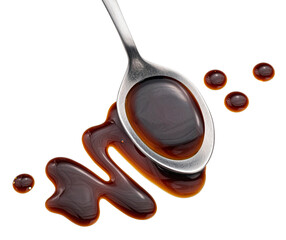 Balsamic sauce in spoon isolated on white background, top view