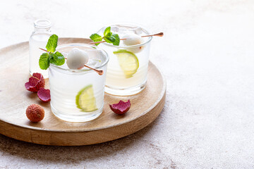 Mint Honey Lime and Lychee cocktail. Lime soda ginger refreshing summer drink. Lychee Mojito
