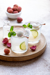 Mint Honey Lime and Lychee cocktail. Lime soda ginger refreshing summer drink. Lychee Mojito