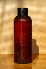Natural cosmetic jar. Brown color. Sunlight cosmetics. Natural cosmetics, water drops. Pharmacy, laboratory, natural cosmetics.