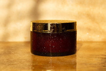 Natural cosmetic jar. Brown color. Sunlight cosmetics. Natural cosmetics, water drops. Pharmacy, laboratory, natural cosmetics.