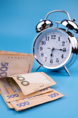 hryvnia banknotes under the clock