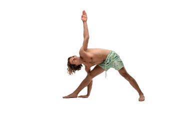 Naked man with raised arms in studio