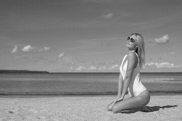 young slim woman in white bodysuit