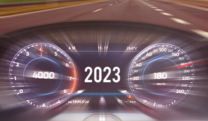 2023 on speedometer of modern car. Fast speed on the speedometer. Road