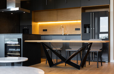 Kitchen interior with dining table in modern apartment