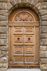 Walking Urbino city streets. Close up view of beautiful ancient wooden door