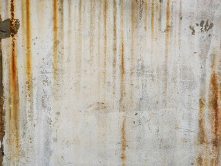 The surface of the cement wall with paint stains from prolonged washing by water