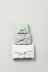reusable sustainable gift wrapping in linen fabric. Furoshiki gifts. zero waste concept flat lay