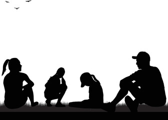 Black silhouettes of a family sitting on the grass.