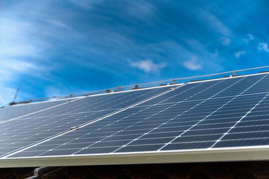 Close-up of solar photovoltaic panels on roof, alternative energy, saving resources and sustainable lifestyle concept.