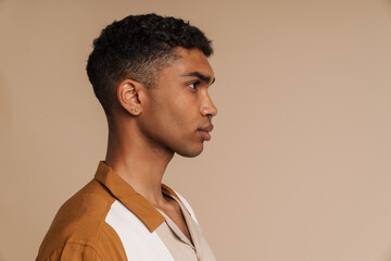 Obraz premium Profile portrait of young handsome serious african man