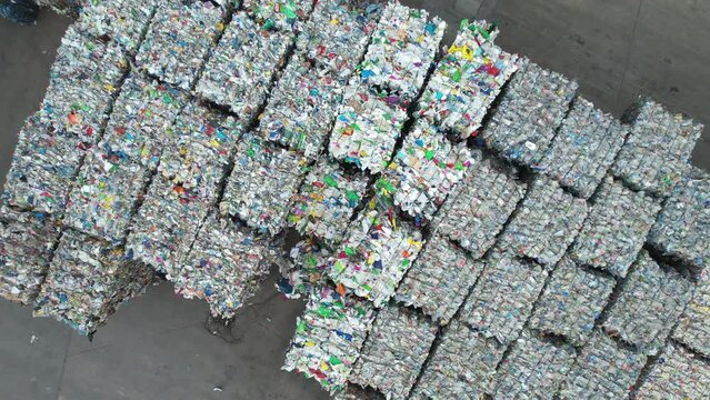 Aerial View of Squeezed Plastic Material Recovered in a Sorting Plant Awaiting Transport to Processing Facility. Waste Recycling Theme.