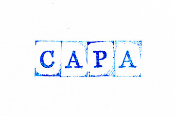 Blue color ink rubber stamp in word CAPA (abbreviation of corrective action and preventive action)...