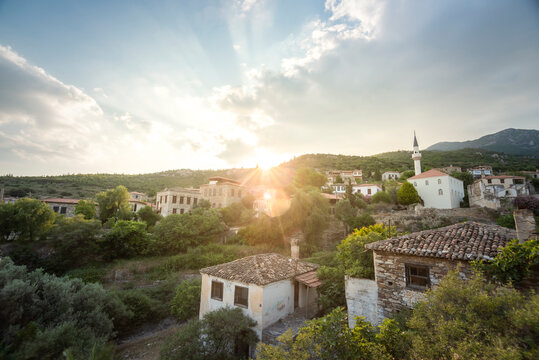 Old stone made buildings with beautiful sun light, stone houses wodden doors and nice flowers restorated town concept