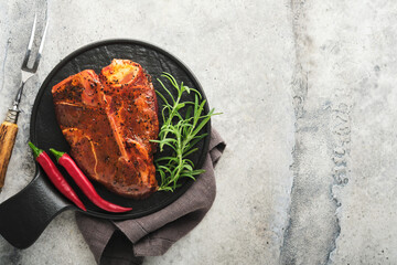 Raw steak t-bone or porterhouse. Steak t-bone or porterhouse in sauce with spices, salt and...