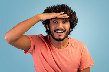 Excited indian man looking at camera, closeup