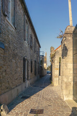 Street view into a characteristic bystreet in Carentan, Normandy, France