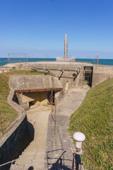 Entrance of German World War 2 concrete bunker with concrete french at Pointe du Hoc,...