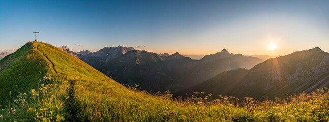 Stunning sunset hike from the top in the austria mountain - obrazy, fototapety, plakaty