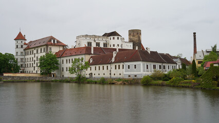 Fototapeta na wymiar Jindrichuv Hradec Castle and Chateau, beautiful landmark towering above pond, popular tourist destination