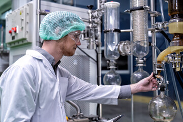 maintenance engineer scientist routine check the distillation glass siphon tube