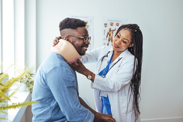 Fototapeta premium Man with cervical neck collar at doctor office, asking for help and being in pain. Patient with medical foam brace waiting to attend checkup examination appointment to cure injury after accident.