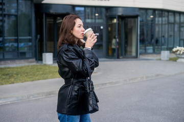 Fototapeta premium Woman Going To Work With Coffee Walking Near Office Building