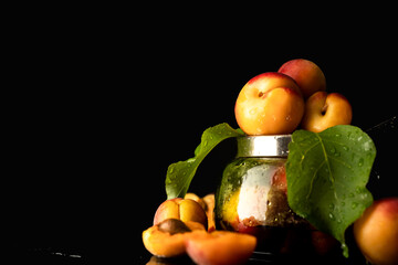 still life of ripe apricots on a dark background 