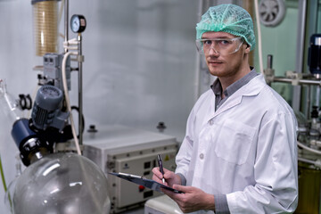 maintenance engineer scientist routine check the distillation glass siphon tube
